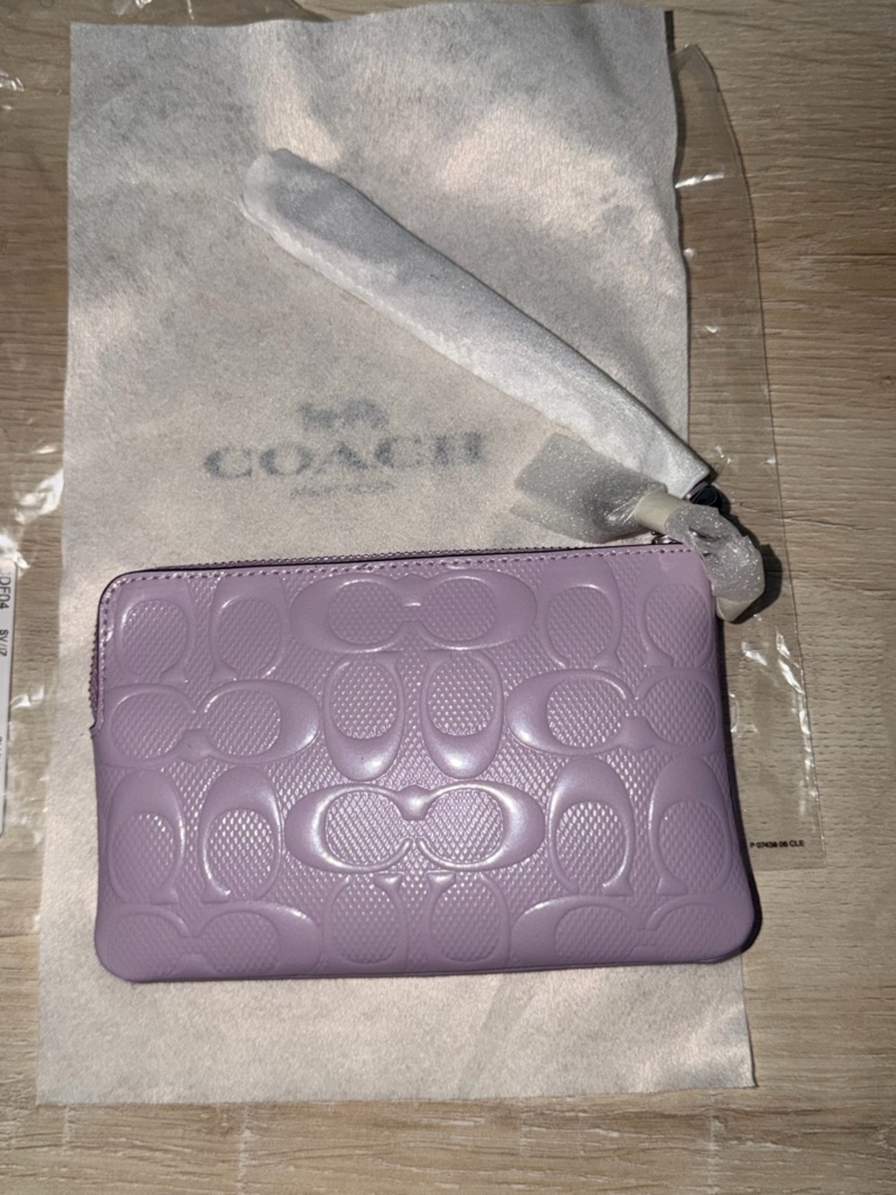 Coach (AUTHENTIC) Lilac Embossed Signature Leather Wristlet